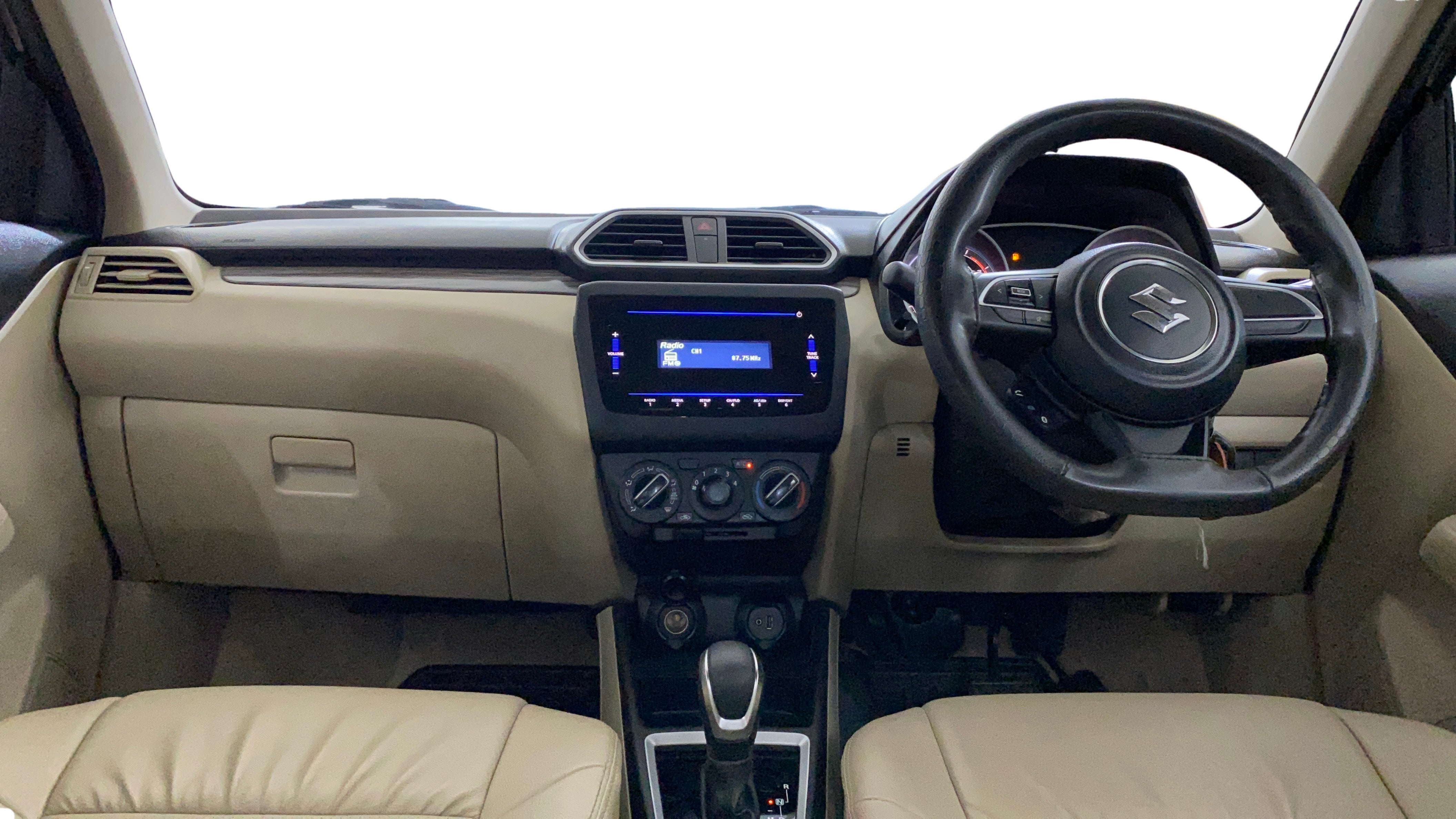 Interior dashboard view of a Maruti Suzuki Dzire 2018-2023