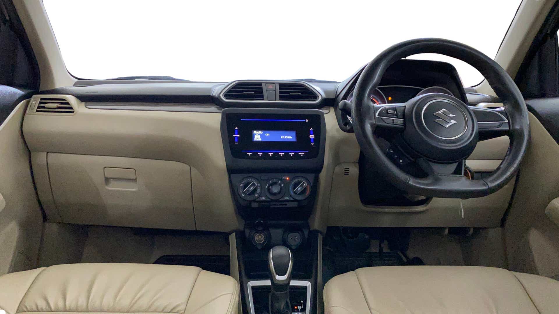 Interior dashboard view of a Maruti Suzuki Dzire 2018-2023