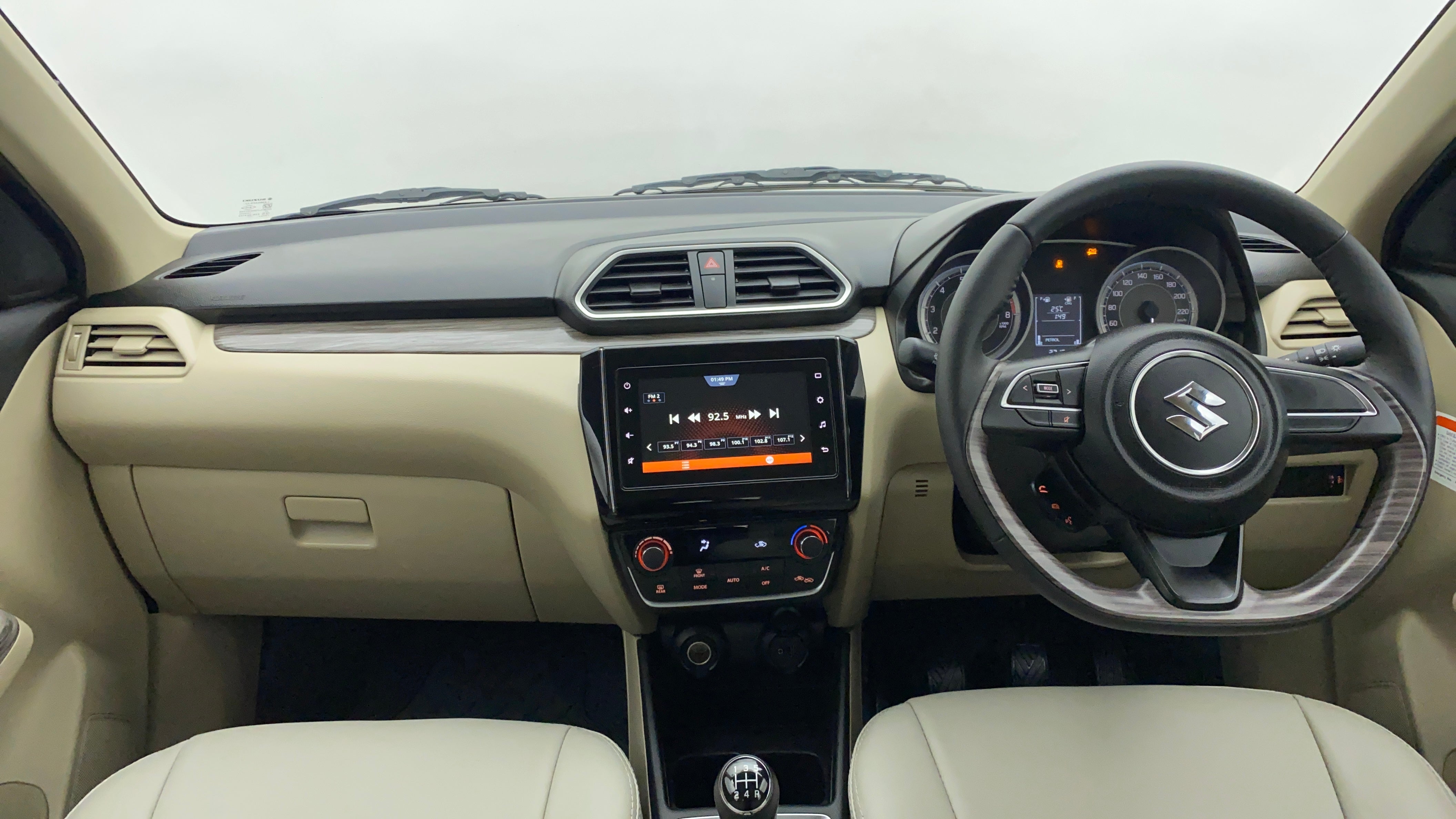 Interior dashboard view of a Maruti Suzuki Dzire 2018-2023