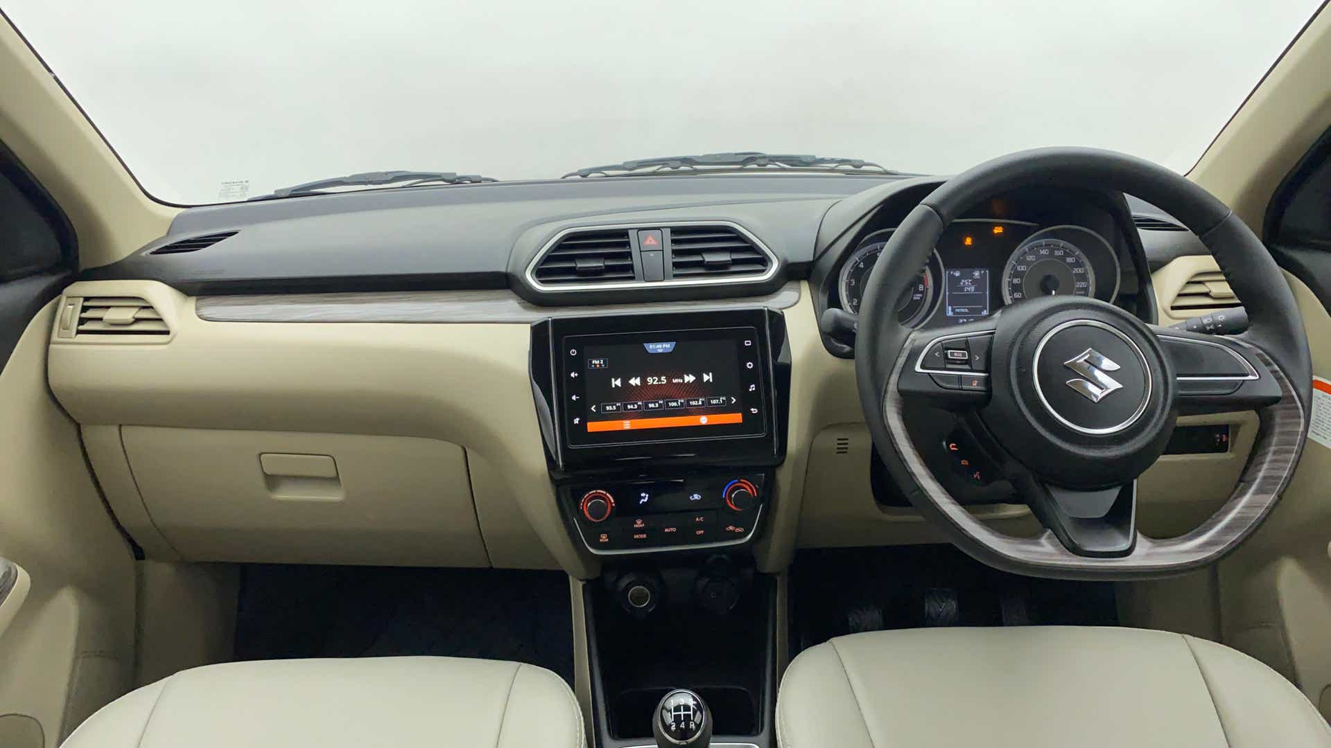 Interior dashboard view of a Maruti Suzuki Dzire 2018-2023