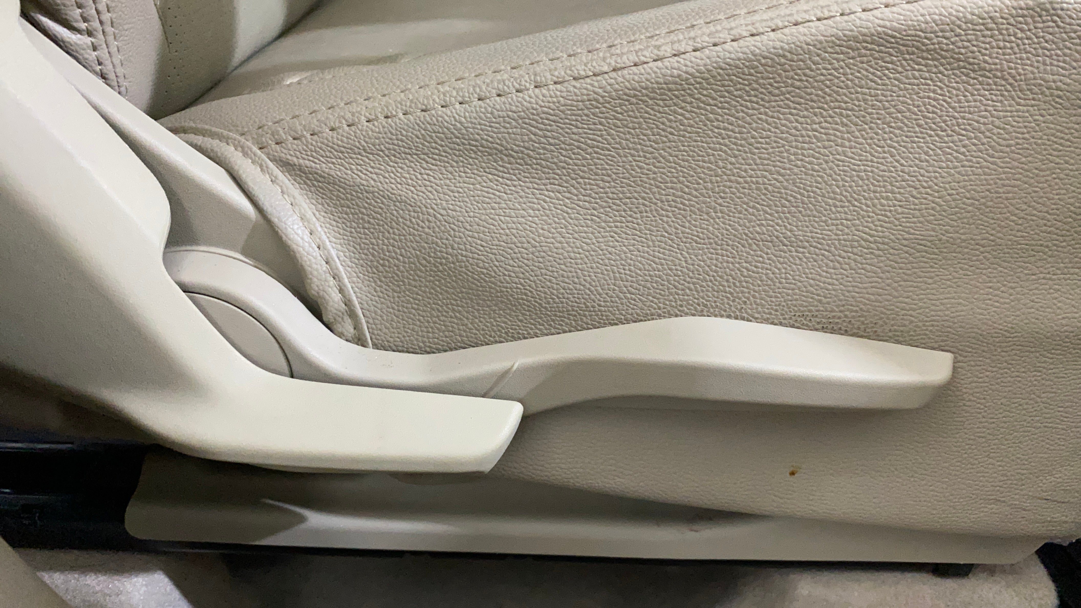 Side view of a seat adjustment lever of a Maruti Suzuki Dzire 2018-2023