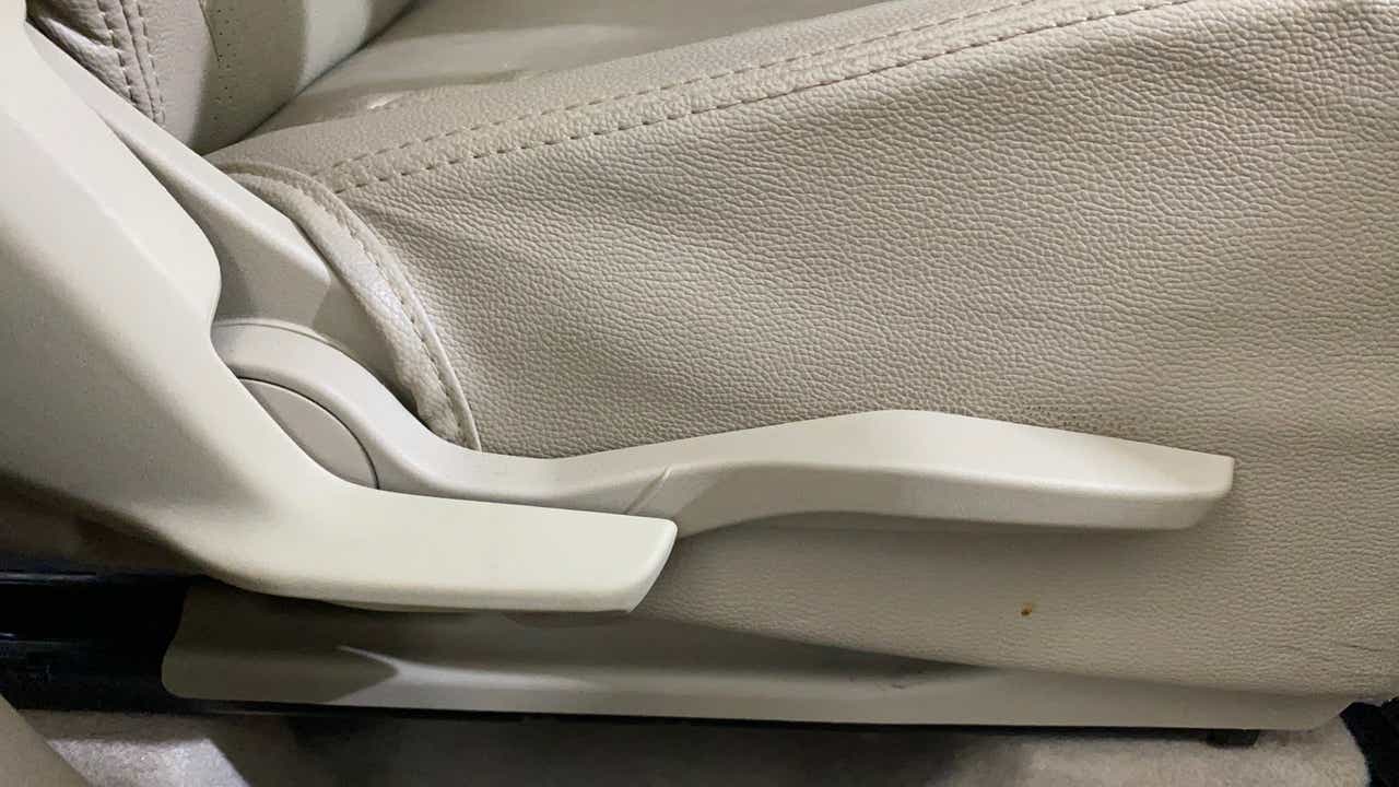 Side view of a seat adjustment lever of a Maruti Suzuki Dzire 2018-2023