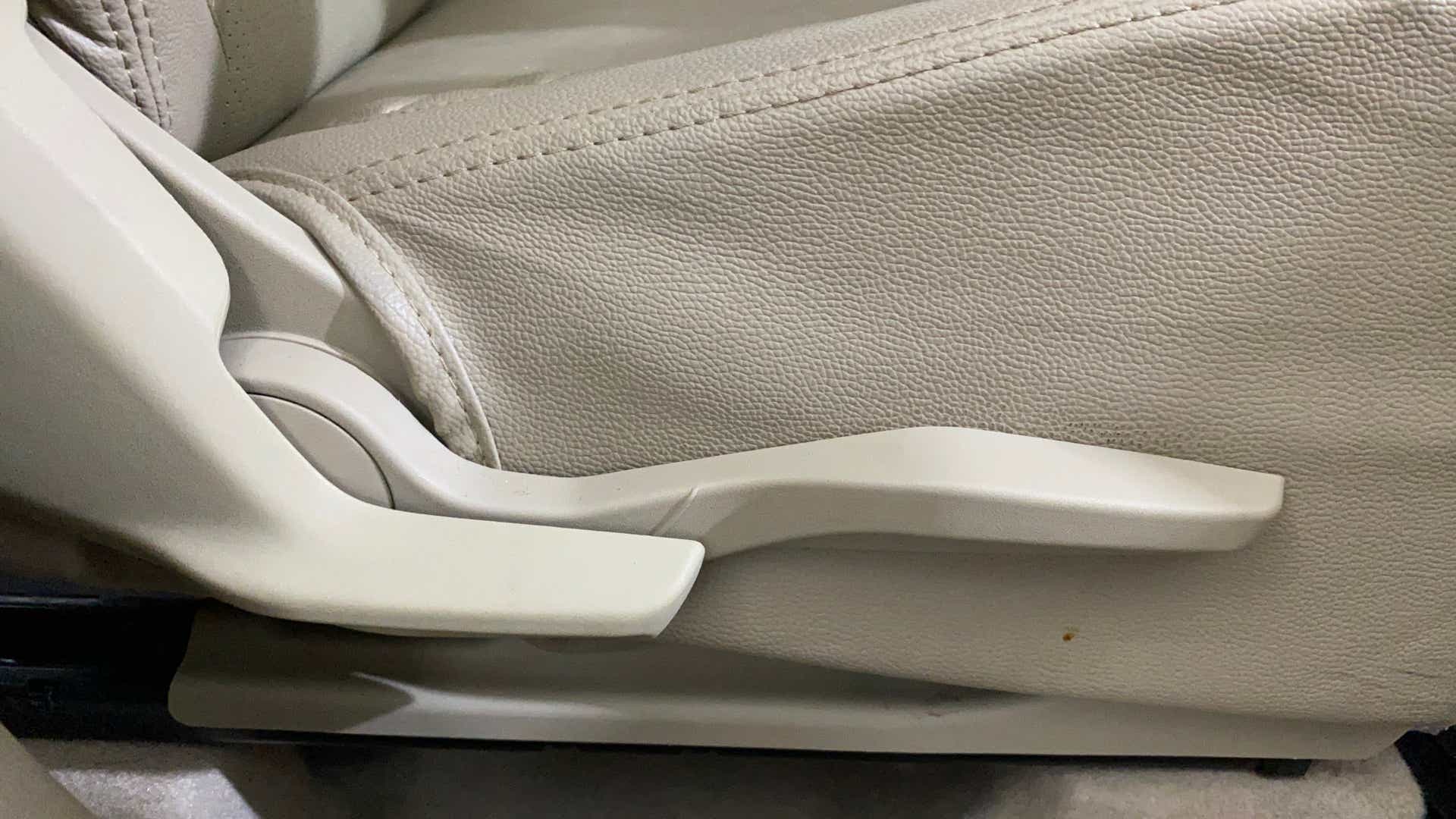 Side view of a seat adjustment lever of a Maruti Suzuki Dzire 2018-2023