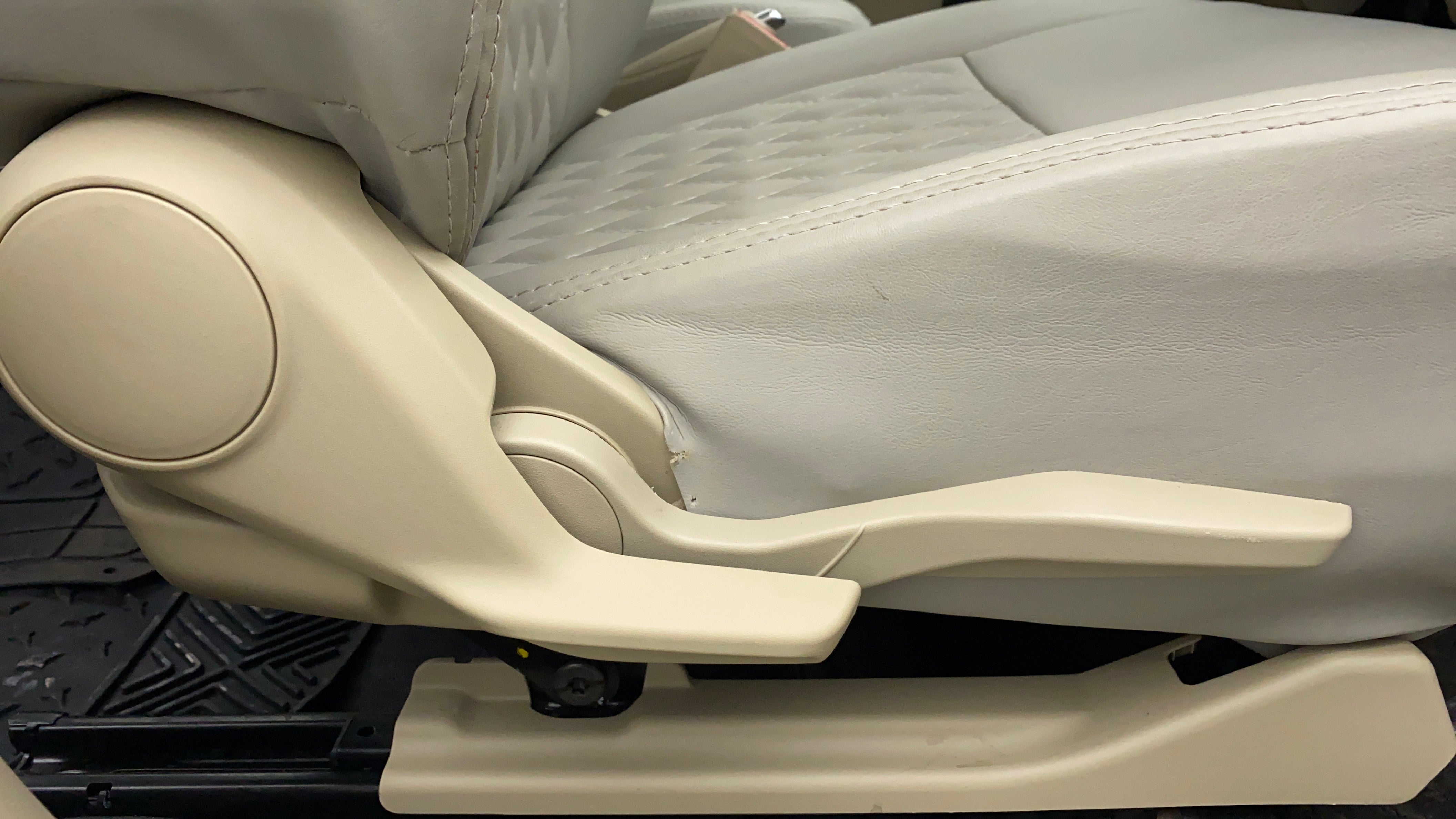 Side view of a seat adjustment lever of a Maruti Suzuki Dzire 2018-2023
