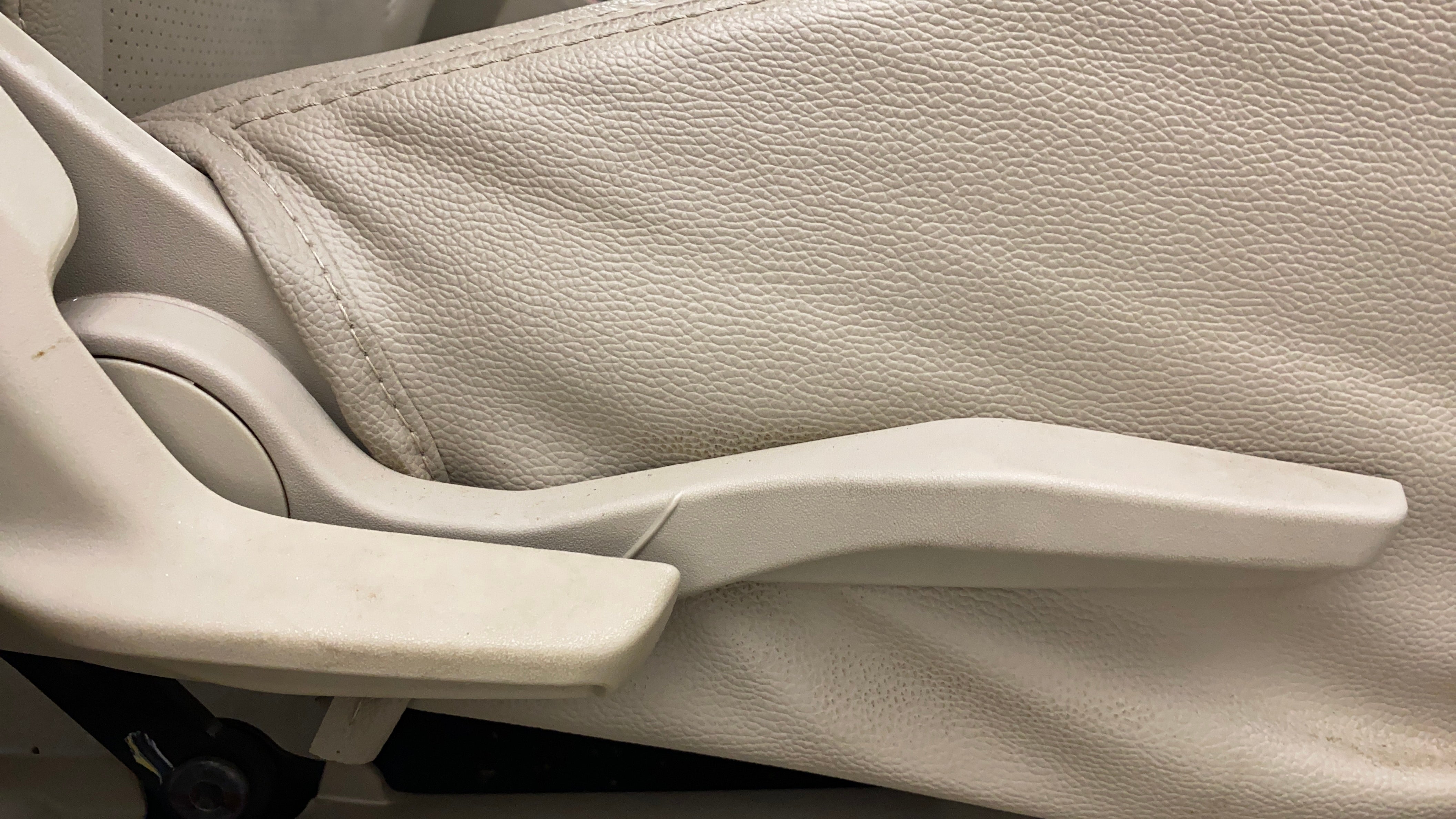 Close-up of seat adjustment lever in a Maruti Suzuki Dzire