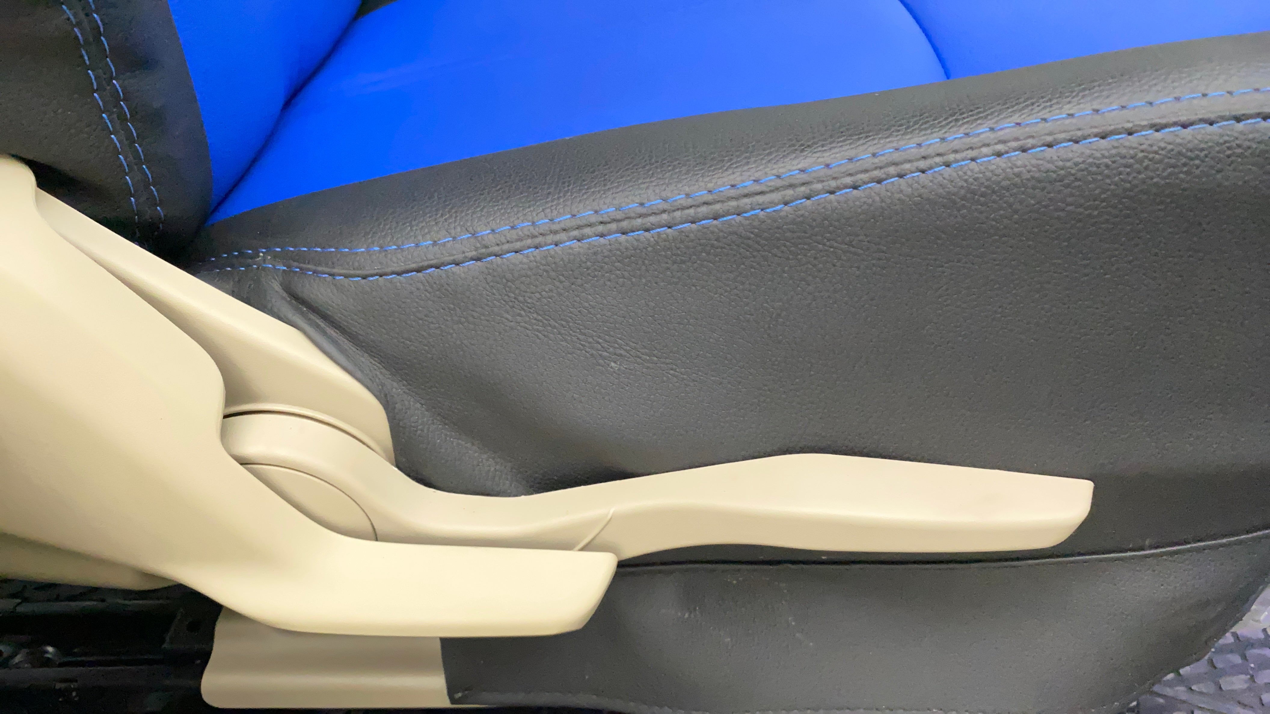 Close-up of the seat adjustment lever of a Maruti Suzuki Dzire 2018-2023