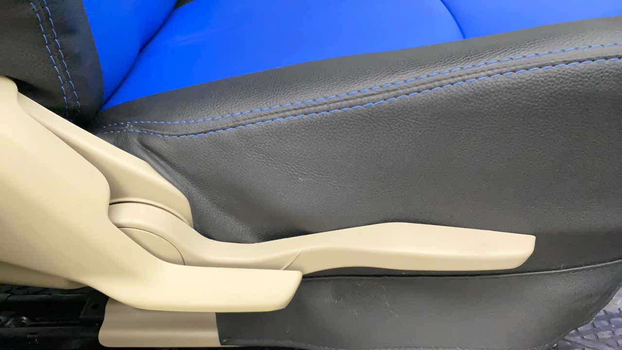 Close-up of the seat adjustment lever of a Maruti Suzuki Dzire 2018-2023