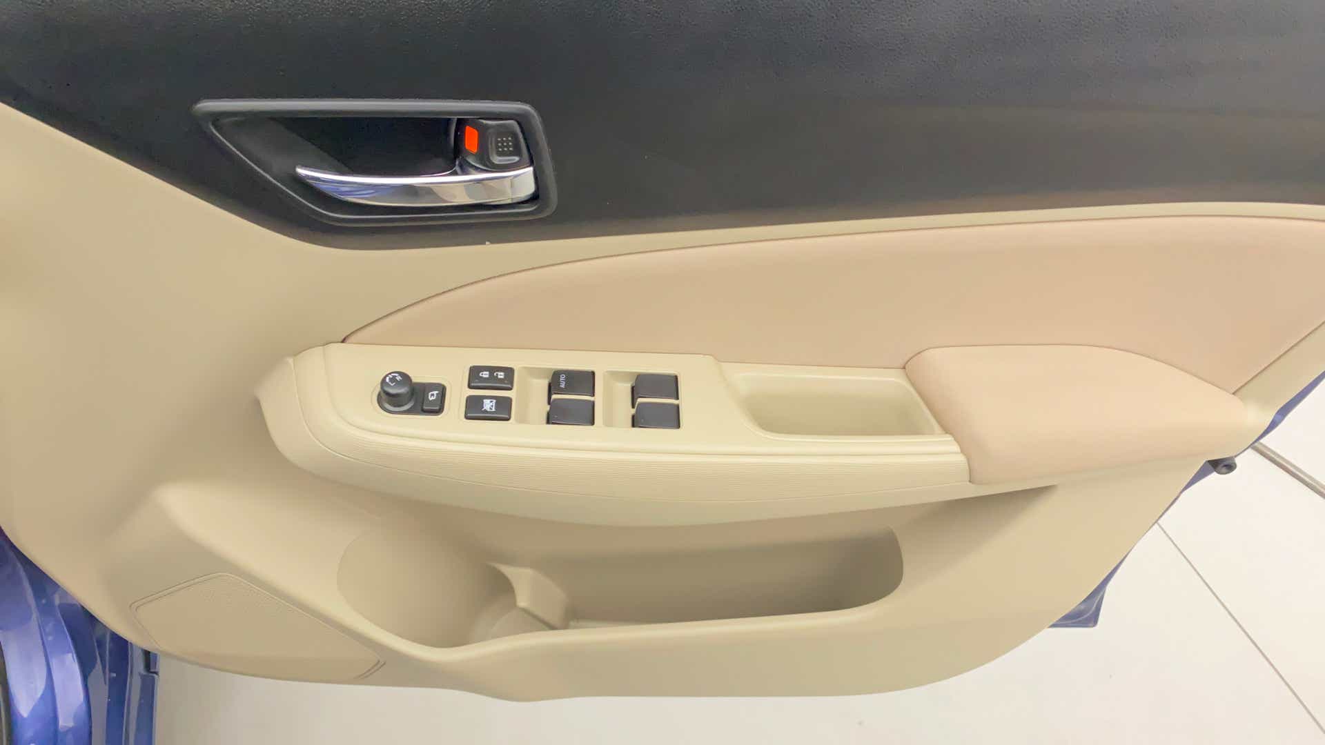 Interior driver side door panel of a Maruti Suzuki Dzire 2018-2023