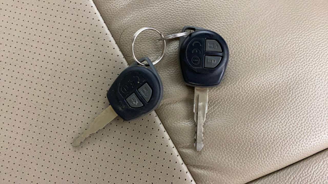 Car keys on the seat of a Maruti Suzuki Dzire