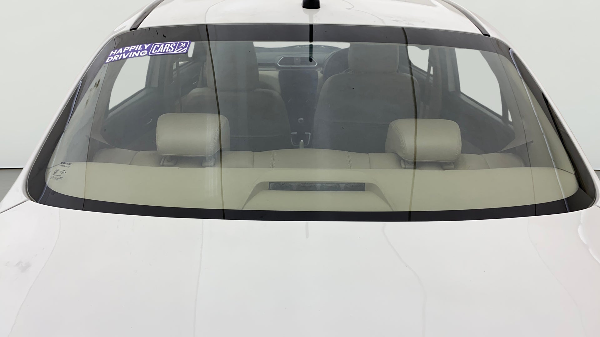 Rear windshield view of a Maruti Suzuki Dzire