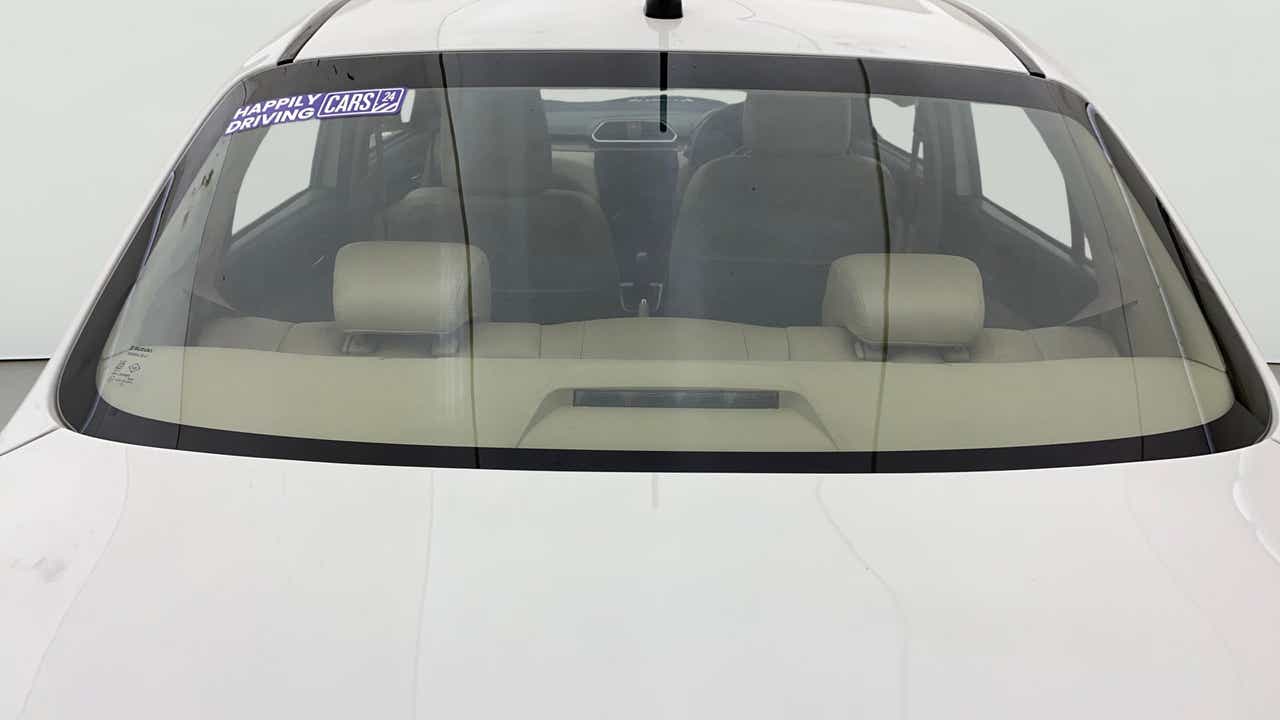 Rear windshield view of a Maruti Suzuki Dzire