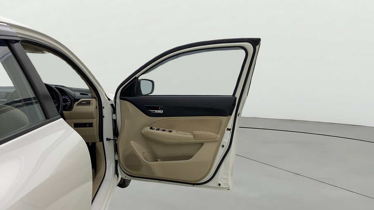 Driver side door and dashboard of a Maruti Suzuki Dzire