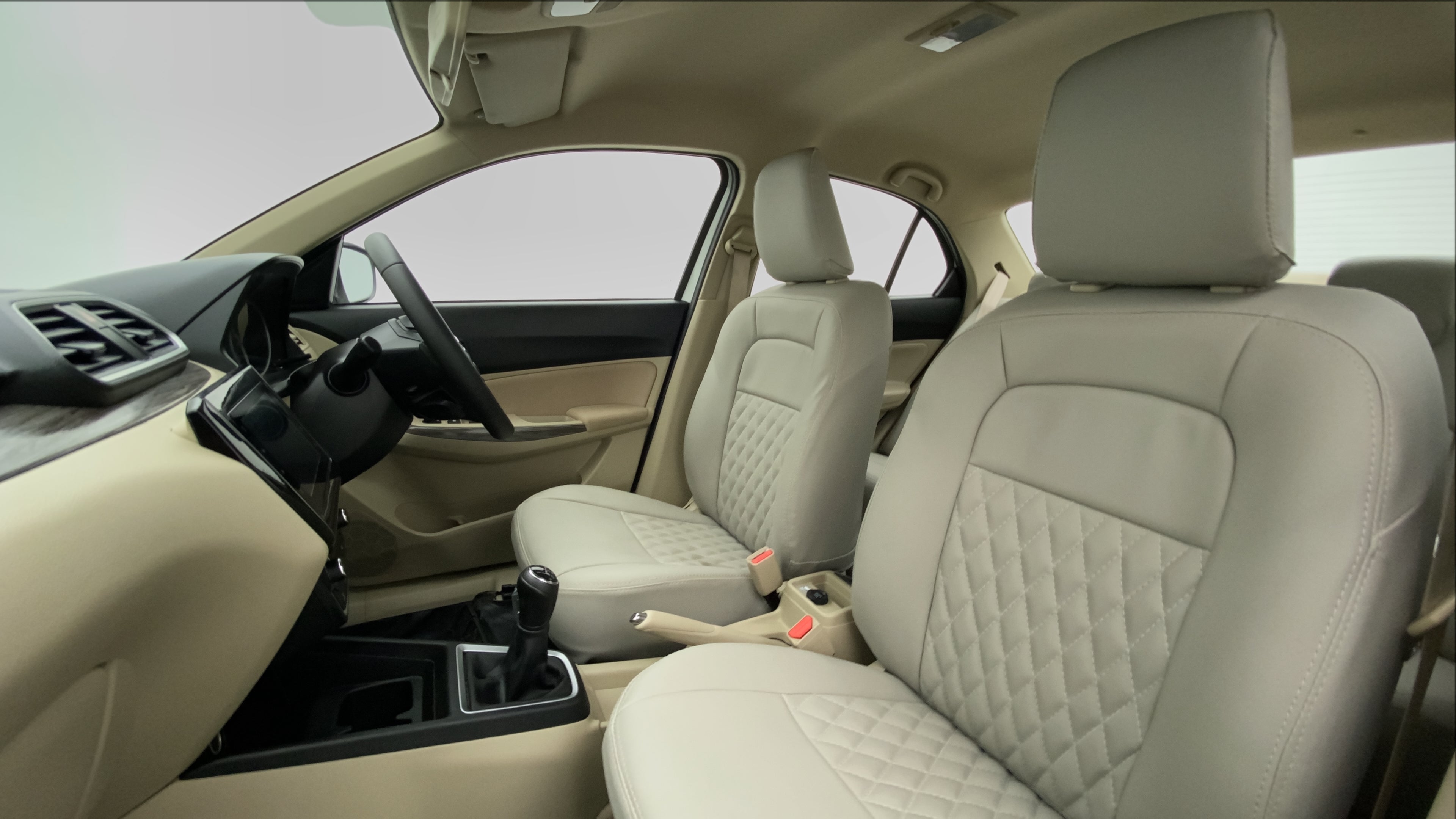 Front seat and dashboard view of a Maruti Suzuki Dzire 2018-2023