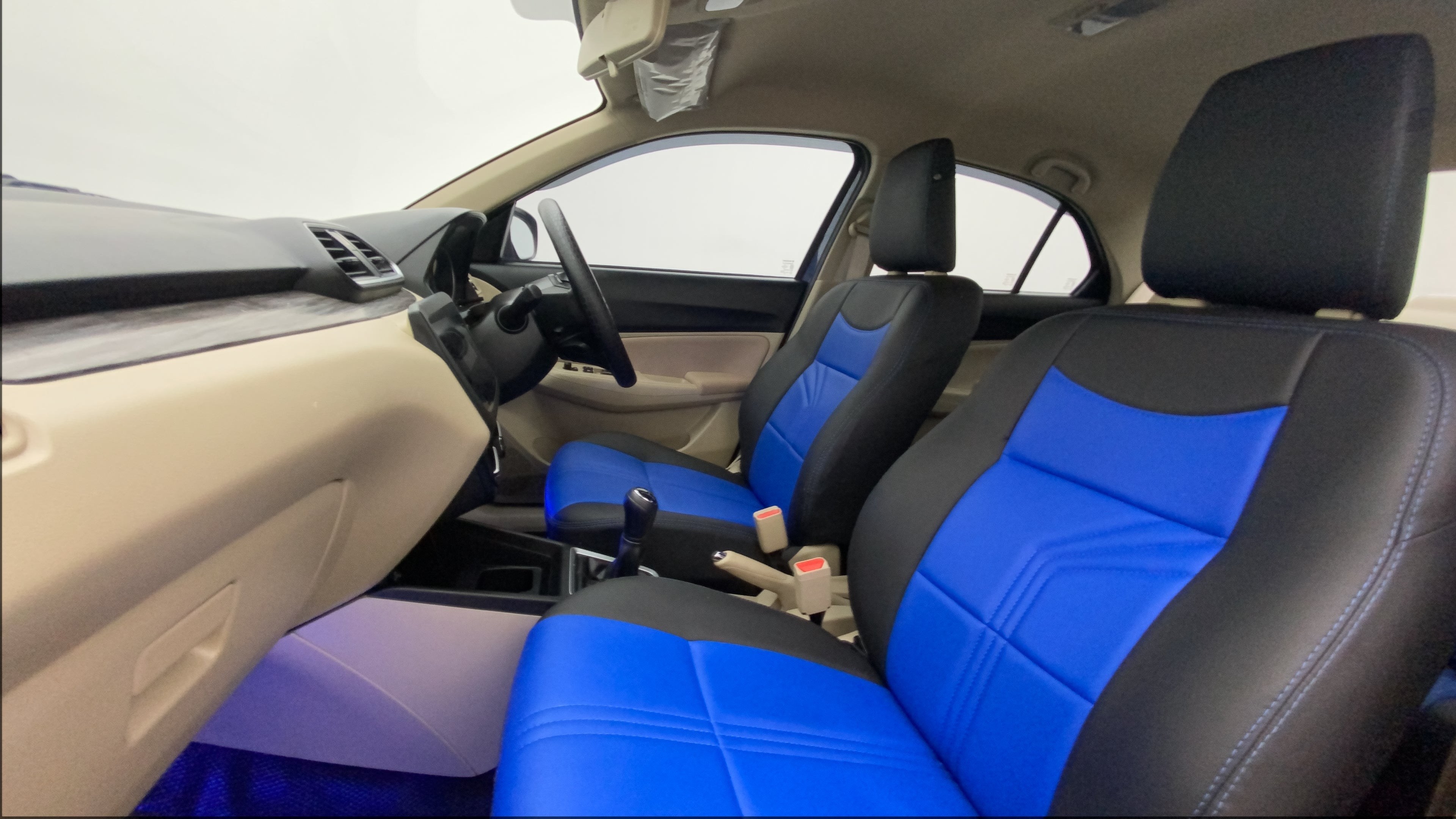 Interior front seats and dashboard of a Maruti Suzuki Dzire 2018-2023