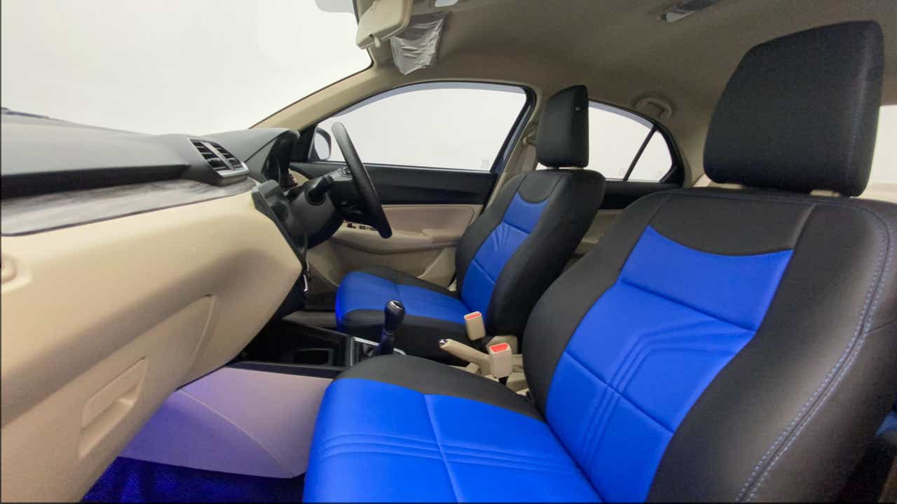 Interior front seats and dashboard of a Maruti Suzuki Dzire 2018-2023