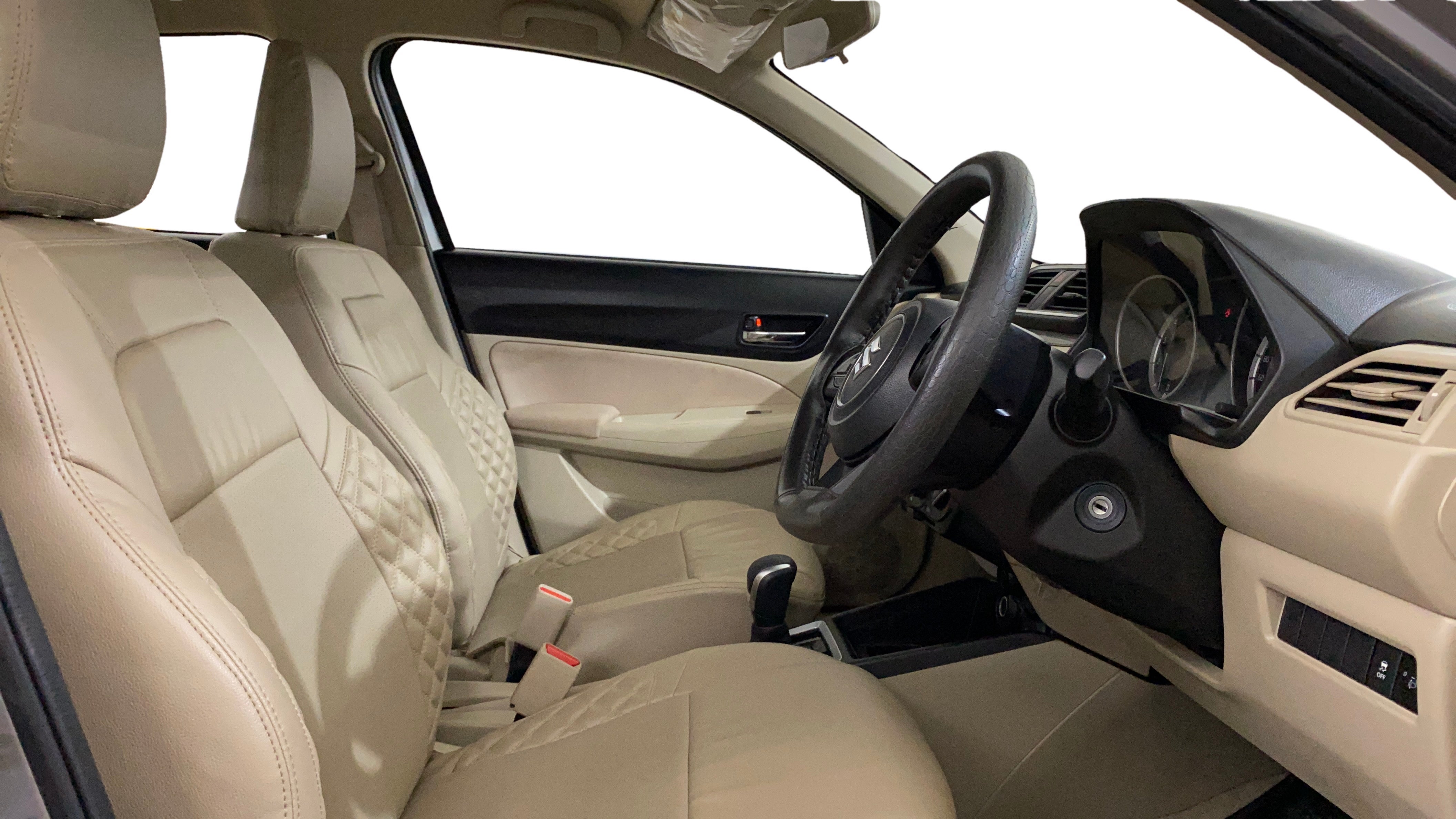 Interior front seats and dashboard of a Maruti Suzuki Dzire 2018-2023