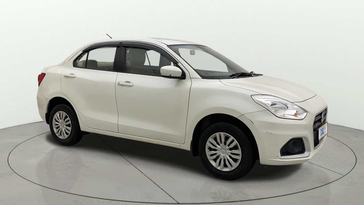 Front three-quarter view of a Pearl Arctic White Maruti Suzuki Dzire