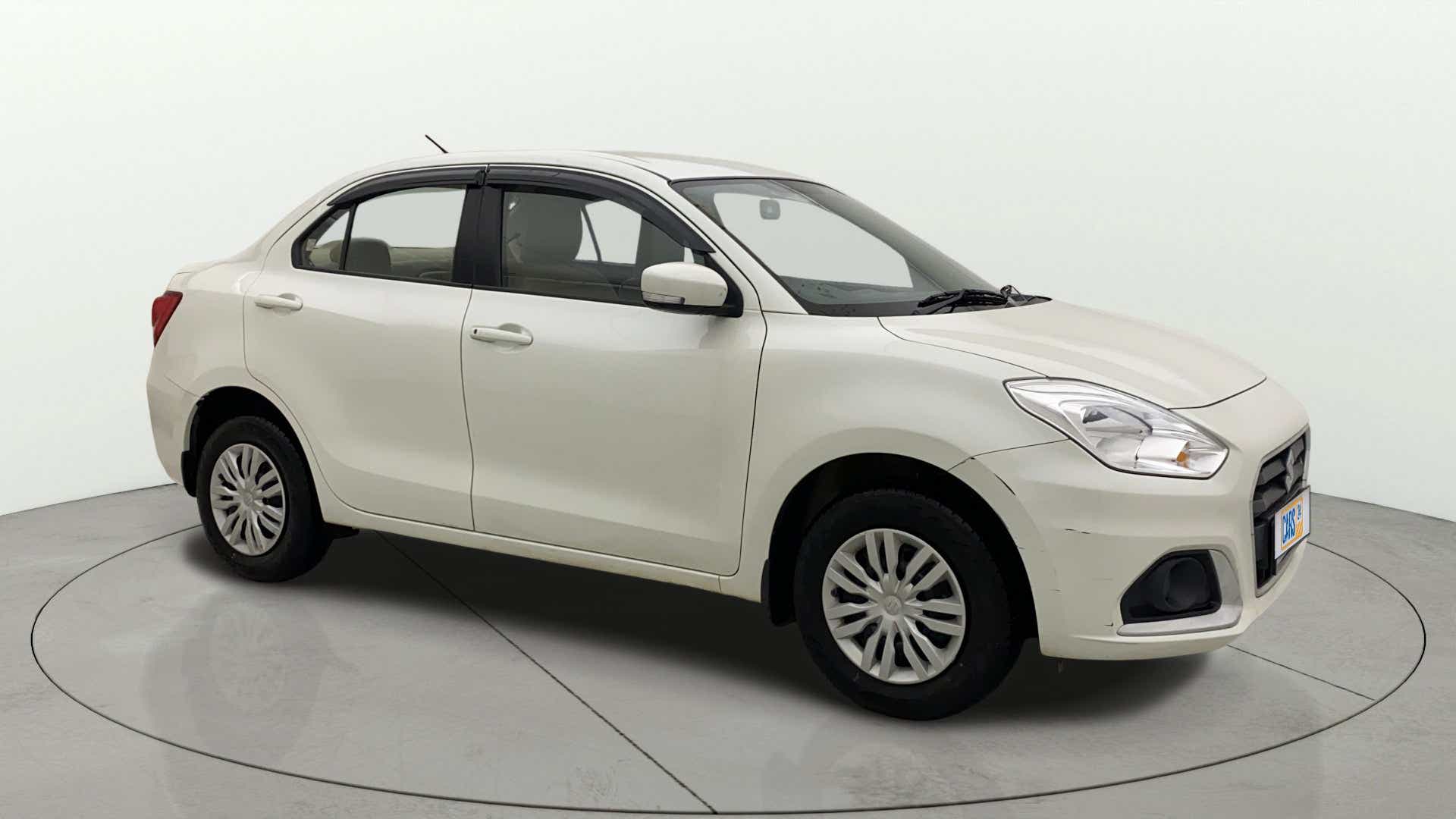 Front three-quarter view of a Pearl Arctic White Maruti Suzuki Dzire