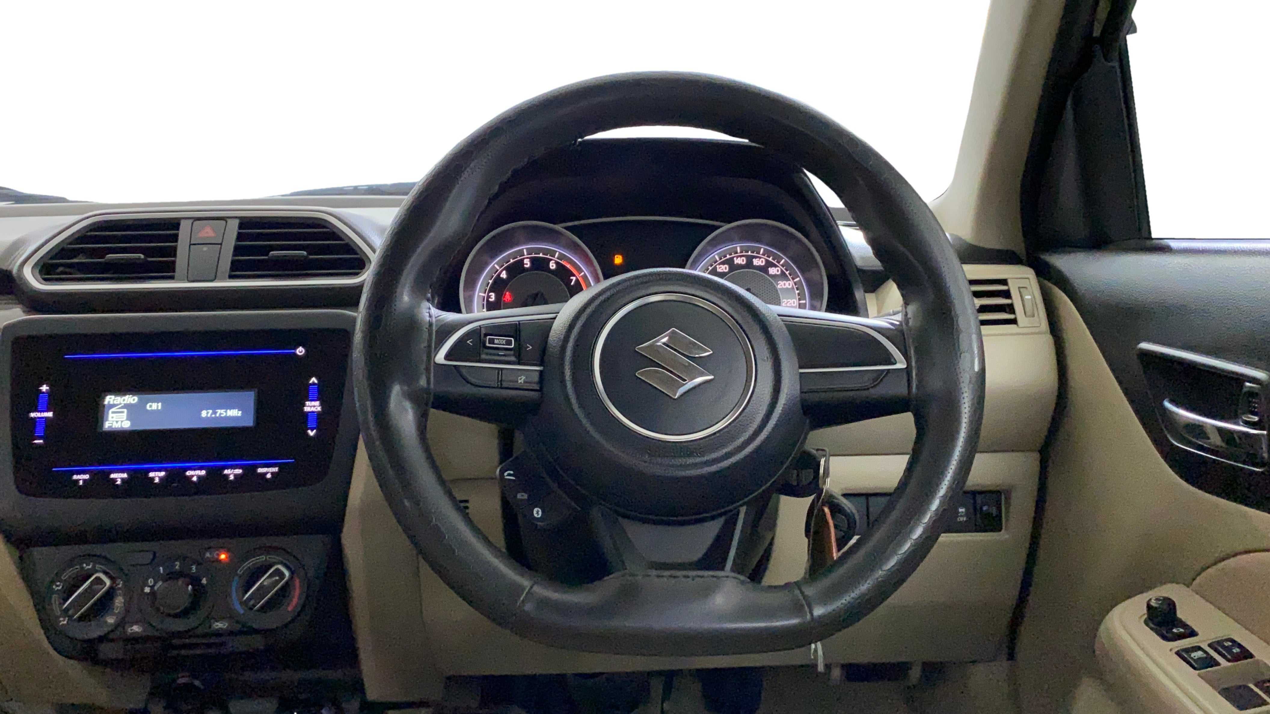 Interior dashboard and steering wheel of a Maruti Suzuki Dzire 2018-2023