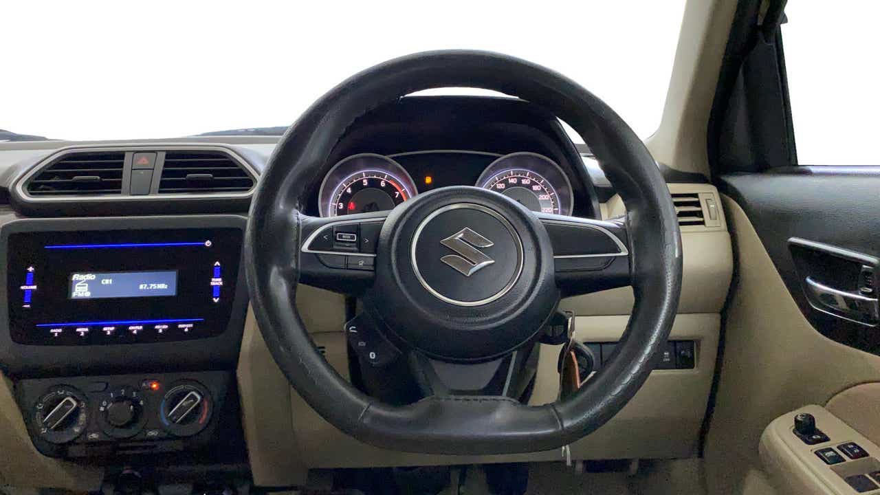 Interior dashboard and steering wheel of a Maruti Suzuki Dzire 2018-2023