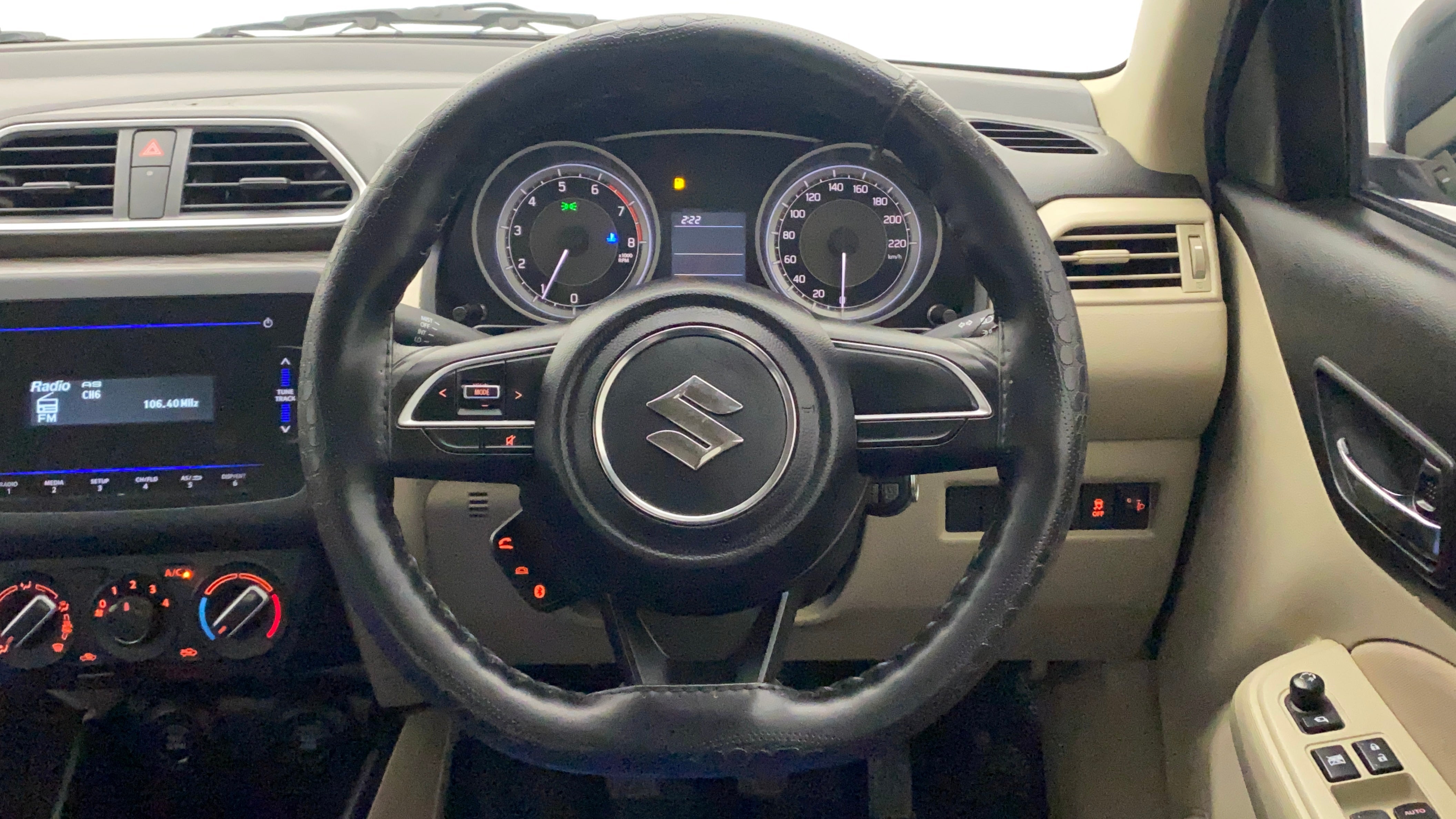 Steering wheel and dashboard of a Maruti Suzuki Dzire 2018-2023