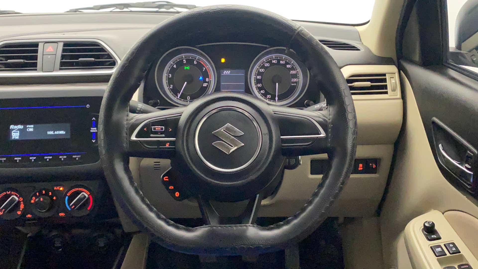 Steering wheel and dashboard of a Maruti Suzuki Dzire 2018-2023