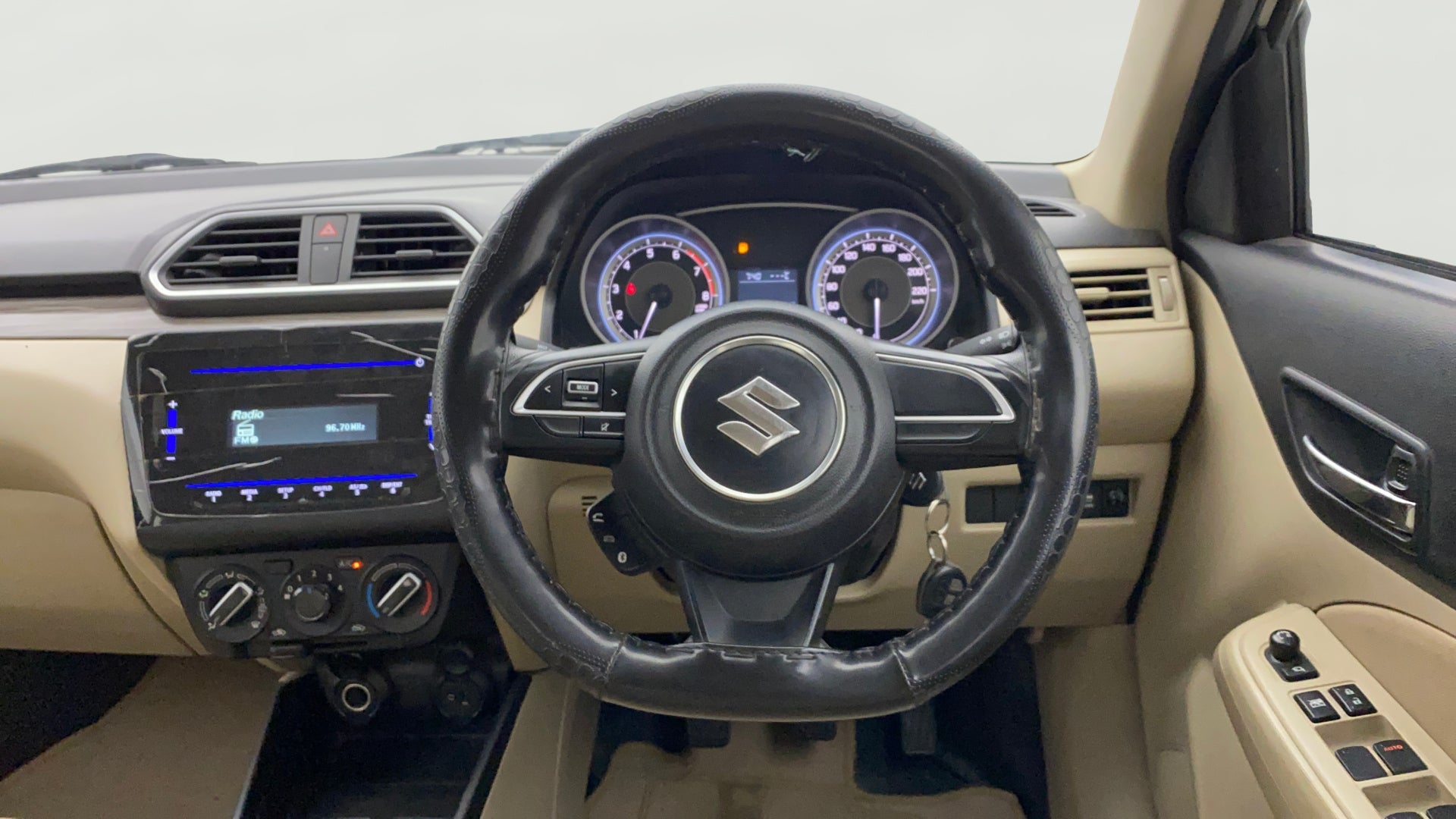 Interior dashboard view of a Maruti Suzuki Dzire