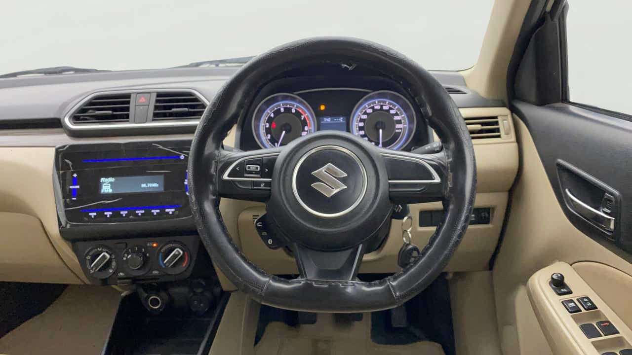 Interior dashboard view of a Maruti Suzuki Dzire