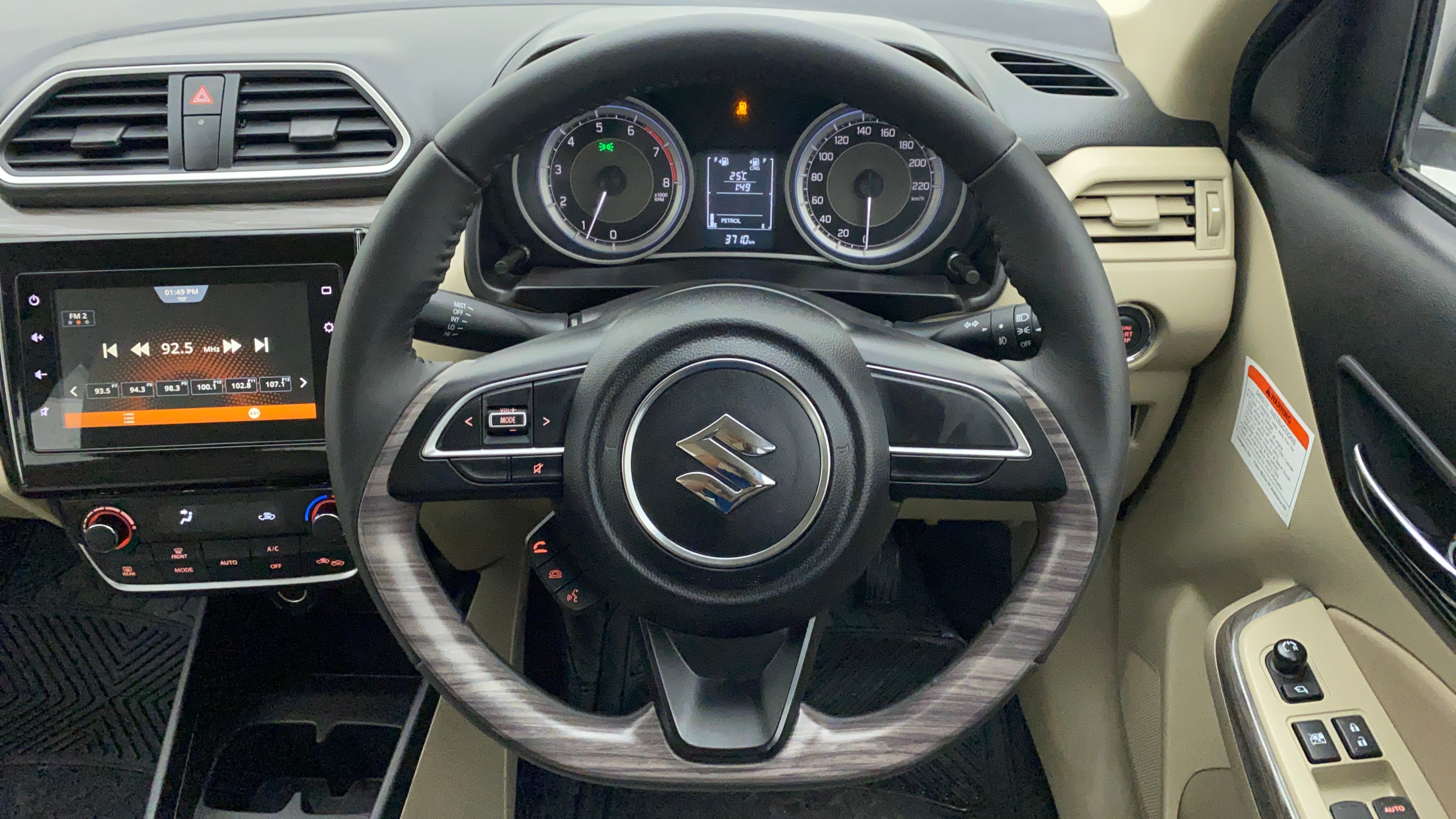 Interior dashboard and steering wheel of a Maruti Suzuki Dzire 2018-2023