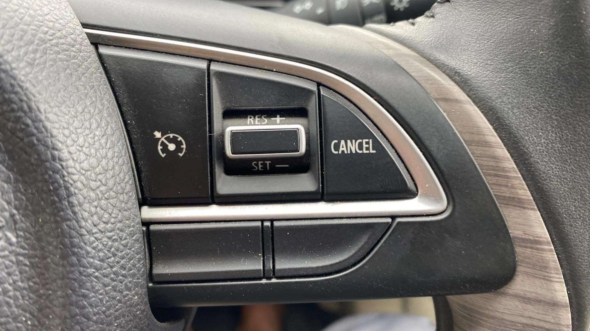 Steering wheel cruise control buttons of a Maruti Suzuki Dzire 2018-2023