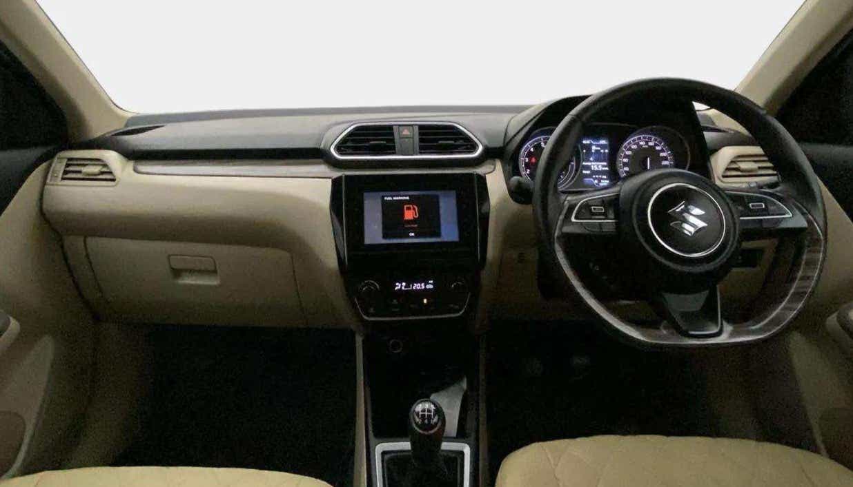 Dashboard and steering wheel of a Maruti Suzuki Dzire