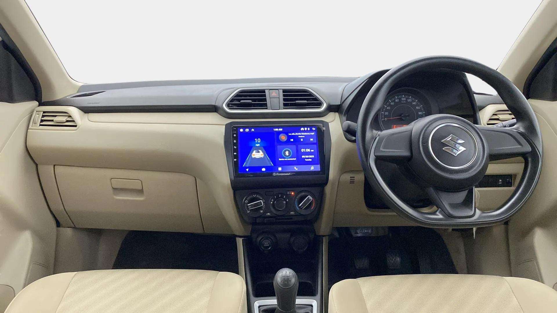 Interior dashboard view of a Maruti Suzuki Dzire