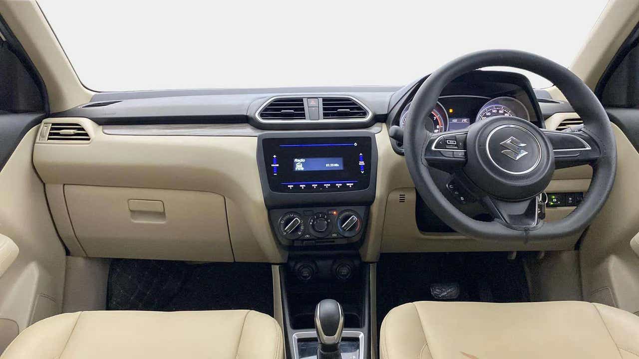 Dashboard and steering wheel view of a Maruti Suzuki Dzire