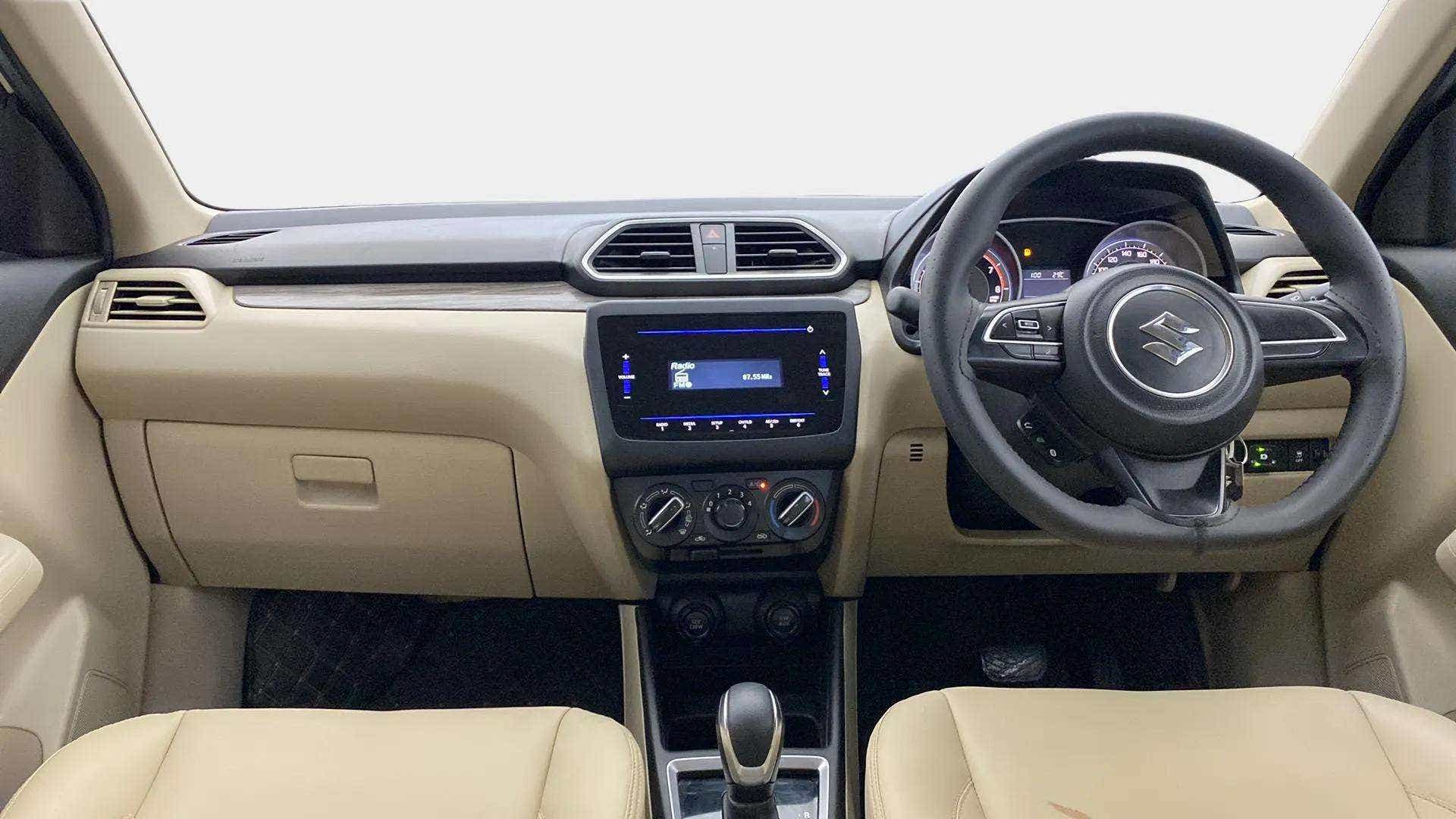 Dashboard and steering wheel view of a Maruti Suzuki Dzire