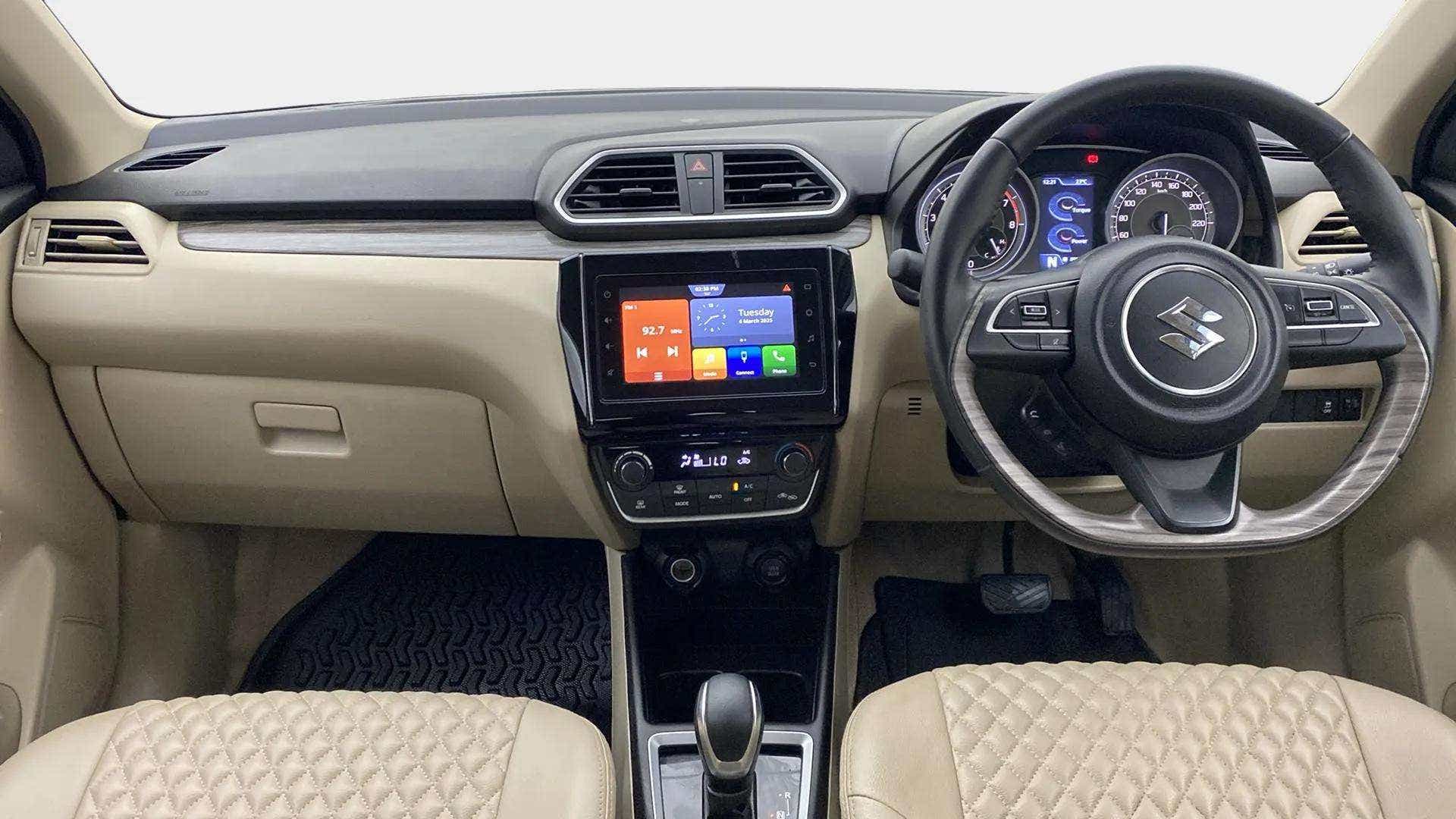 Interior dashboard view of a Maruti Suzuki Dzire 2018-2023