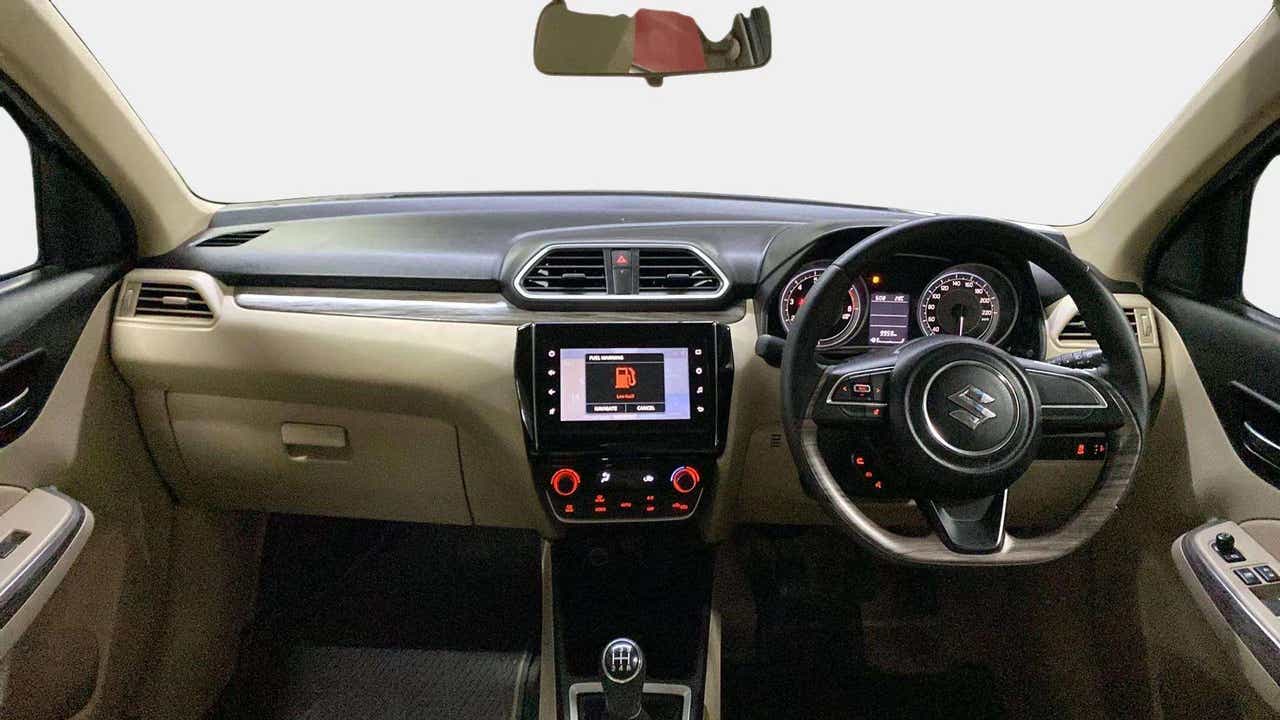 Interior dashboard view of a Maruti Suzuki Dzire 2018-2023