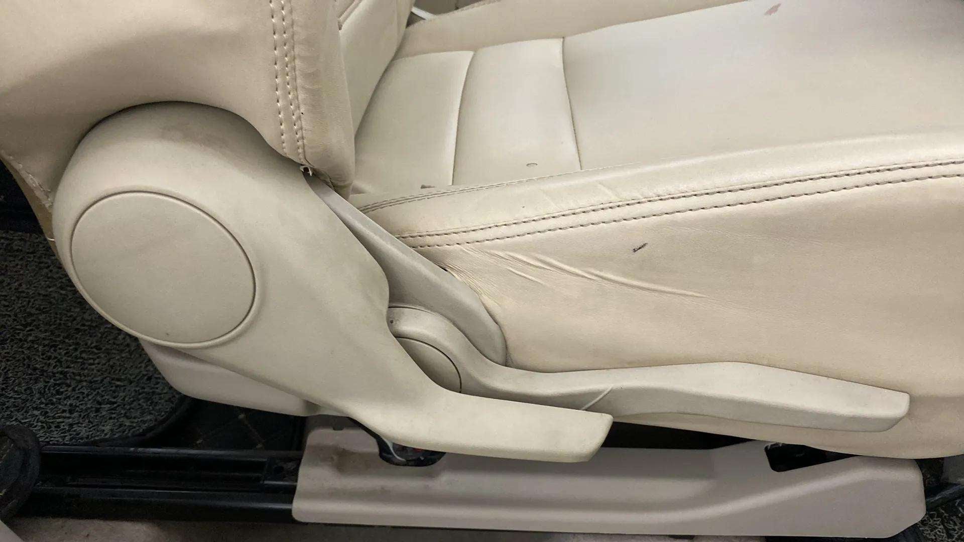 Side view of a seat adjustment lever of a Maruti Suzuki Dzire