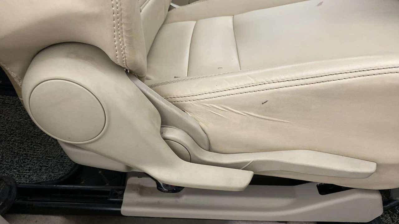 Side view of a seat adjustment lever of a Maruti Suzuki Dzire