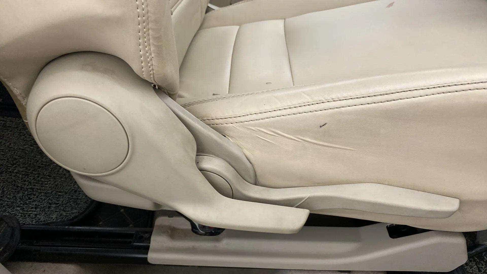 Side view of a seat adjustment lever of a Maruti Suzuki Dzire