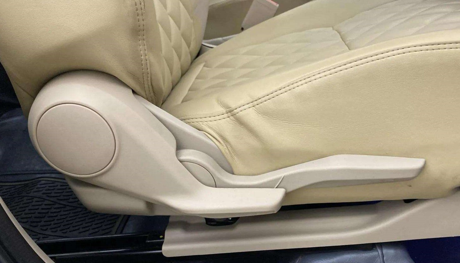 Close-up of the seat adjuster lever of a Maruti Suzuki Dzire