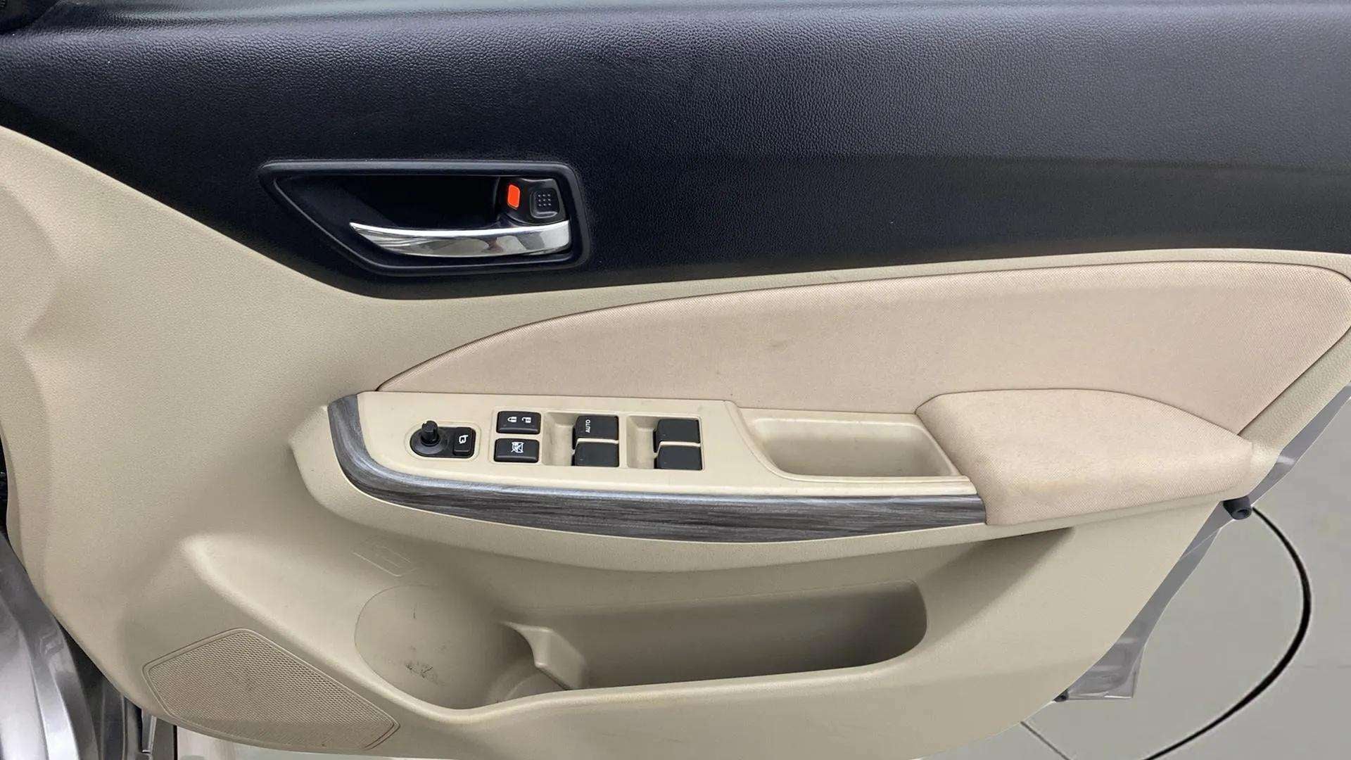 Interior door panel of a Maruti Suzuki Dzire 2018-2023