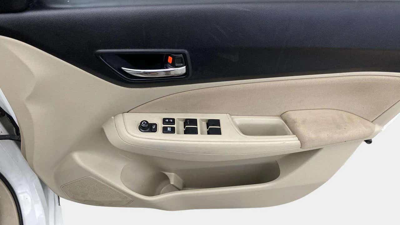 Driver side door panel of a Maruti Suzuki Dzire