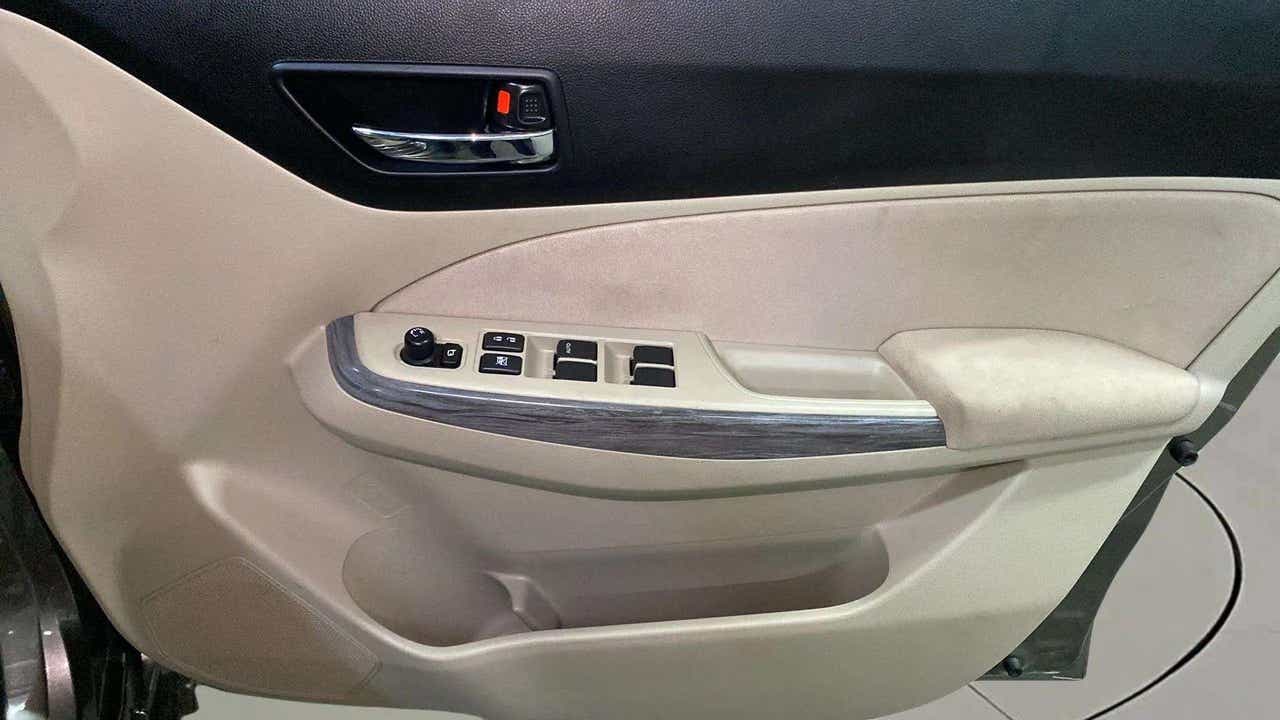 Driver side door controls of a Maruti Suzuki Dzire 2018-2023