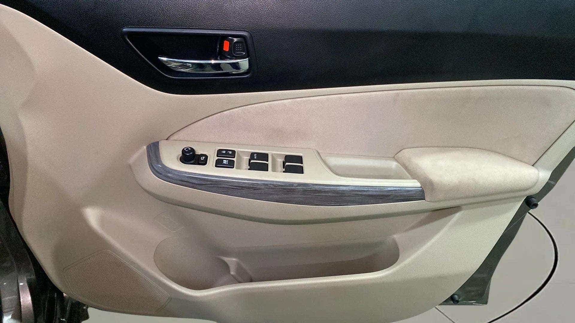 Driver side door controls of a Maruti Suzuki Dzire 2018-2023