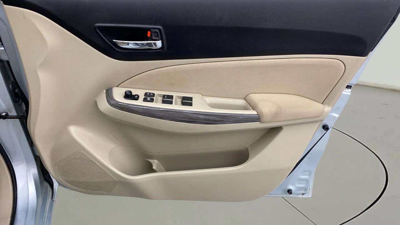 Interior door panel of a Maruti Suzuki Dzire