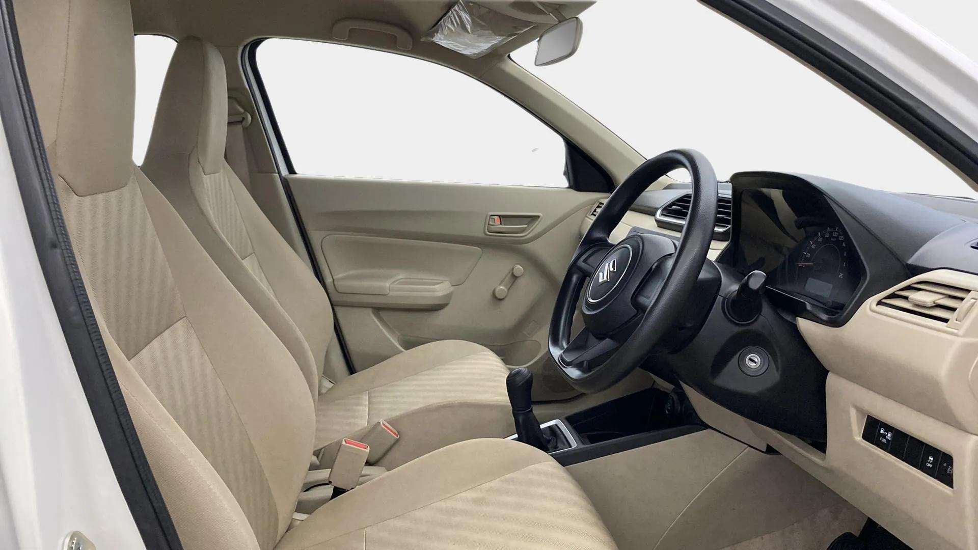 Interior dashboard view of a Maruti Suzuki Dzire
