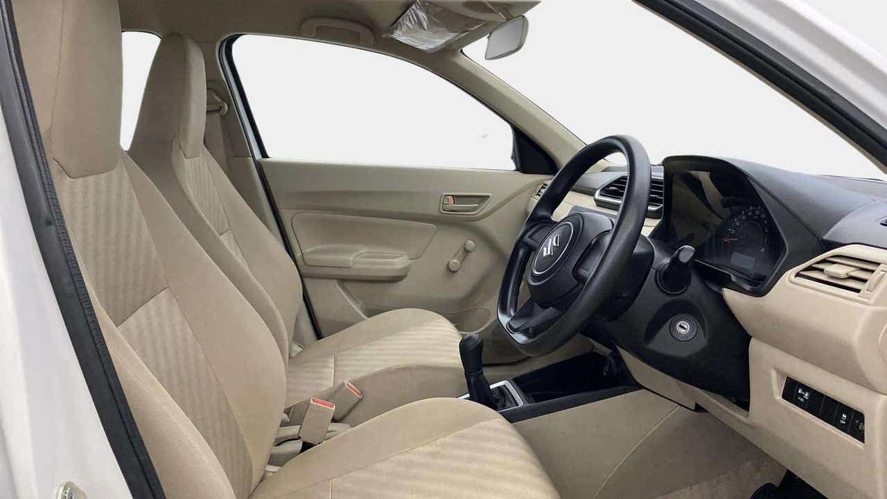 Interior dashboard view of a Maruti Suzuki Dzire