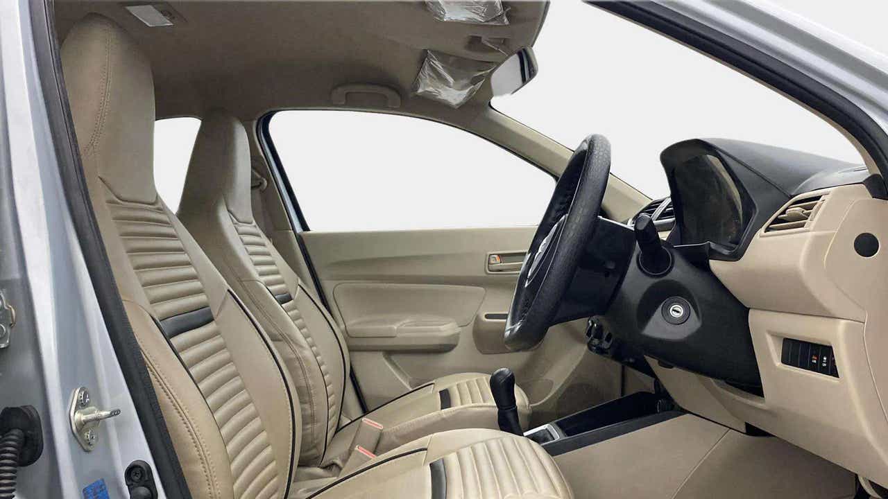 Interior front seats and dashboard of a Maruti Suzuki Dzire 2018-2023