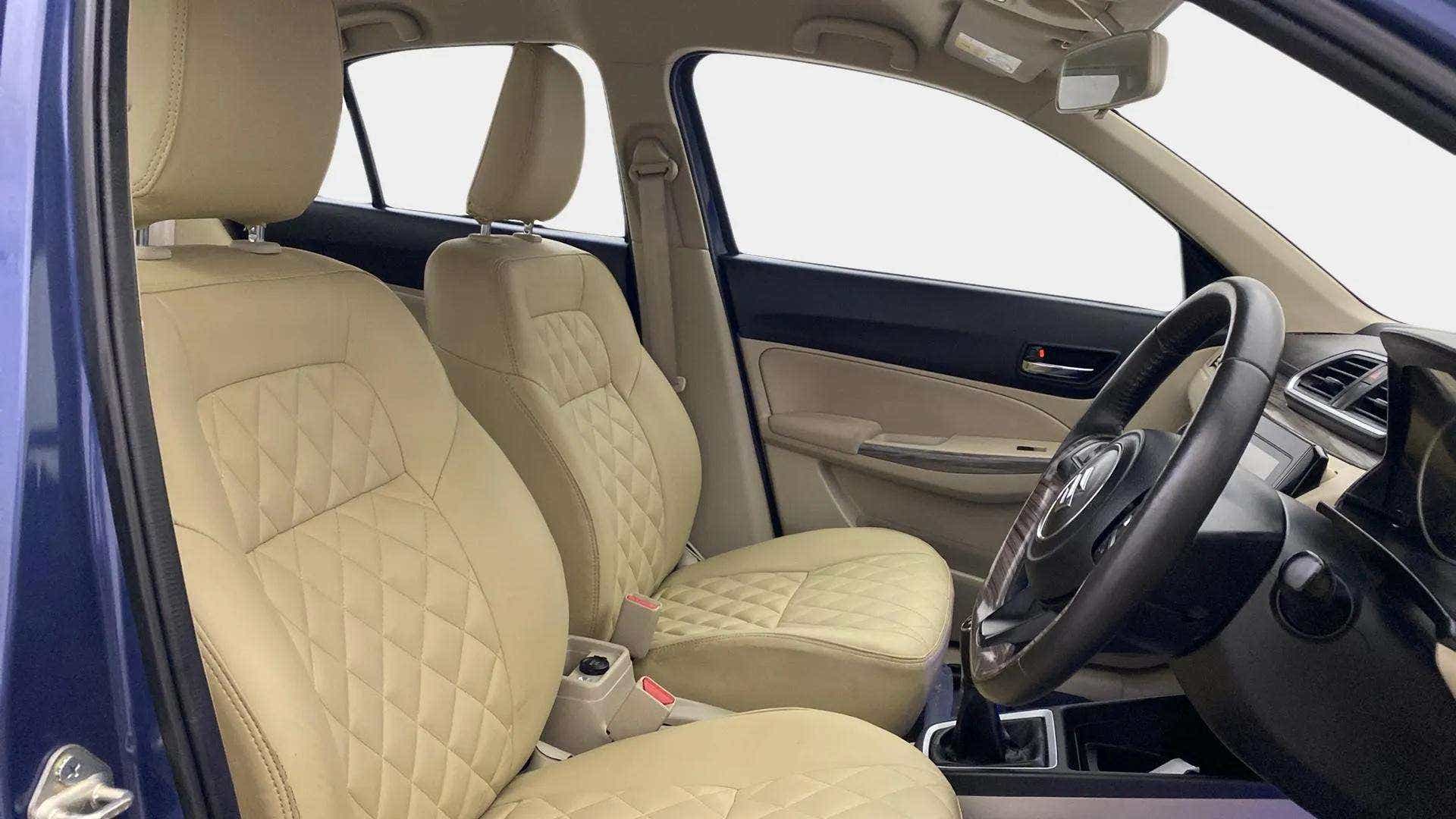 Front seat and dashboard view of a Maruti Suzuki Dzire
