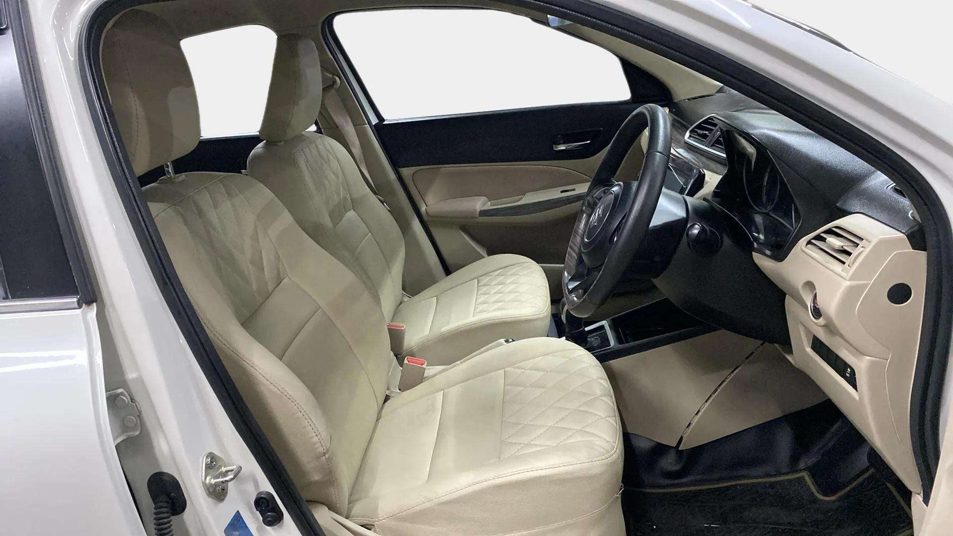 Front interior seats and dashboard of a Maruti Suzuki Dzire 2018-2023